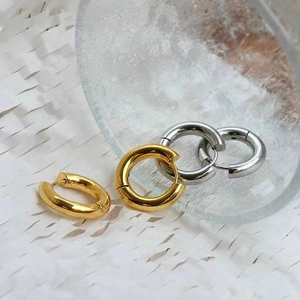 Minimalist thick hoop earrings in gold and silver finish with polished mirror surface