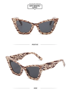 Detail view of cat eye sunglasses with off-white and brown tortoiseshell pattern frames