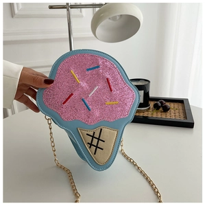 Detail of creative ice cream crossbody bag with pink sequins and golden chain strap