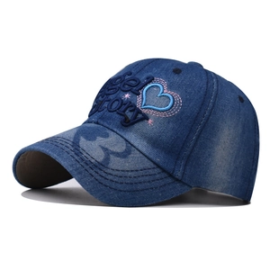 Distressed dark blue denim baseball cap with Angel Story heart embroidery in side view