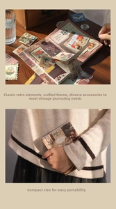 Macro shot of vintage junk journal kit with floral stickers and aesthetic retro papers