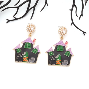 Detail of Halloween ghost house earrings with enamel drip finish and synthetic pearls