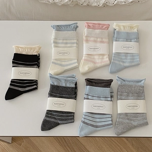 Seven-pack colorful striped cotton socks with ruffled cuffs and cozy ribbed texture