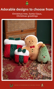 Detailed view of Christmas gingerbread man and plush gift boxes on a vintage wooden cabinet