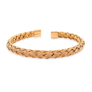 Detail of gold woven stainless steel cable cuff with polished square metal ends
