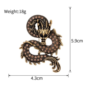 Detail view of vintage enamel dragon brooch with size 5.9x4.3cm and 18g weight