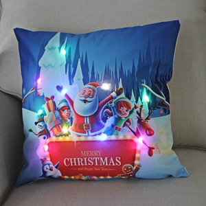 Detail of LED light-up Christmas pillow featuring a Santa Claus print on soft fabric