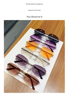 Detail of rimless oval sunglasses showing multiple colorful lens options and metal frames