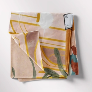 Detail of bohemian tapestry featuring abstract floral patterns and geometric lines