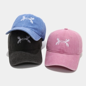 Washed cotton baseball caps with antler embroidery in navy, black, and grey-pink