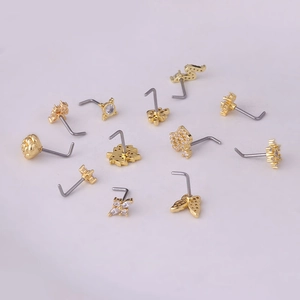 Various 20G gold titanium steel nose studs with cubic zirconia butterfly and flower designs