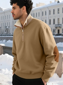 Detailed close-up of khaki half-zip sweatshirt with sherpa-lined collar and brown elbow patches