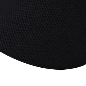 Close-up of the durable black twill fabric texture on a minimalist women's military cap