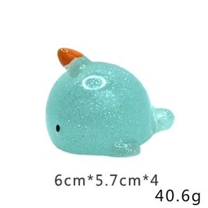 Macro detail of blue glitter narwhal squishy toy with dimensions 6cm x 5.7cm x 4cm