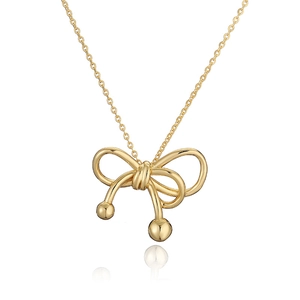 Elegant gold bow pendant necklace with a polished metallic finish on a white background