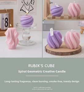 Detail showing spiral geometric scented candles in purple and pink with fine textures
