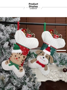 Detail of Christmas stockings with cartoon cat and dog designs and holiday ornaments