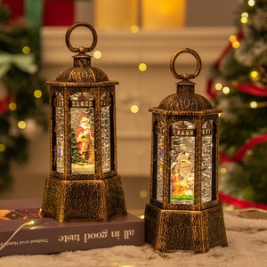 Bronze Christmas LED lantern with glitter snow effects and Santa Claus nativity scene