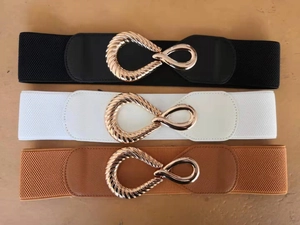 Trio of wide elastic waist belts in black, white and brown with gold twist buckle