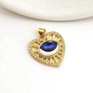 Golden heart-shaped evil eye pendant with sparkling white zircons for jewelry making