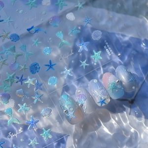 Détails de stickers à ongles en gel thème océan avec motifs étoiles de mer nacrées