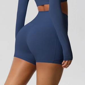 Detail of high-waist navy blue compression yoga shorts with shaping effect for sports