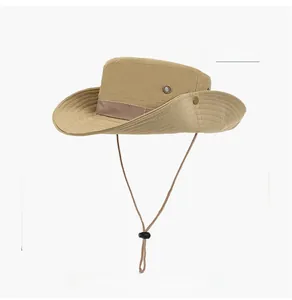 Detail of khaki sun hat with wide brim, metal vents, and adjustable chin strap