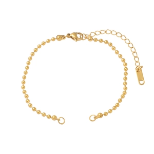 Detailed view of a gold-plated stainless steel bead bracelet with adjustable lobster clasp