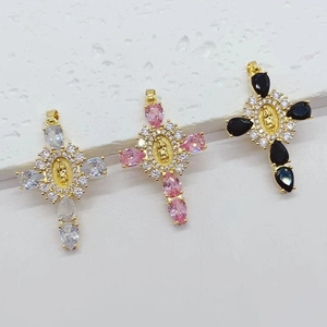 Religious cross pendants with micro-paved cubic zirconia in gold, pink, and black colors