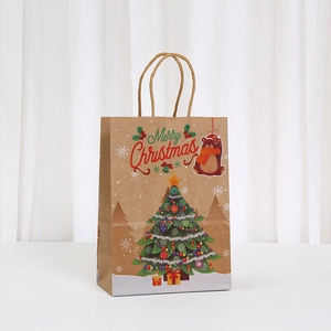 Close-up of Christmas kraft paper gift bag featuring a cute bear and festive tree prints