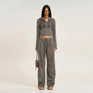Full view of vintage gray hoodie and wide-leg sweatpants set in a retro street style