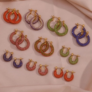 Close-up of gold stainless steel hoop earrings with colorful pavé zircon stones