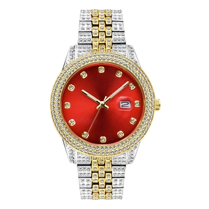 Close-up of iced-out men's watch with red dial, calendar window and crystal accents