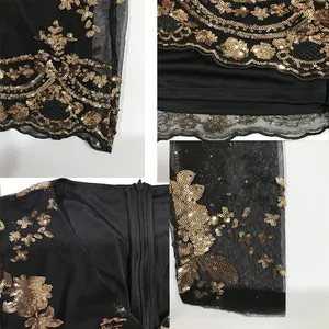 Detail showing gold sequin floral embroidery and sheer black mesh texture on dress
