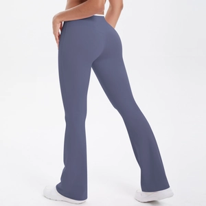Detail of high waisted flare yoga pants in dusty blue with tummy control sculpting effect
