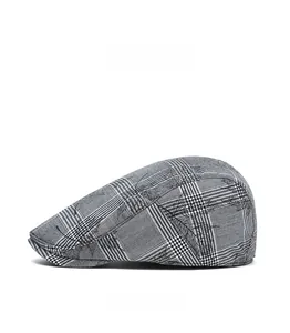 Side view of men's British style flat cap featuring black and white plaid pattern texture