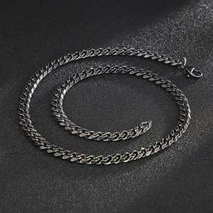 Detail view of gunmetal gray stainless steel Cuban link chain with lobster clasp