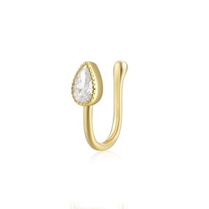 Detailed view of a gold U-shaped nose cuff with a pear-shaped cubic zirconia stone