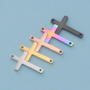Five assorted cross charms in black, rainbow, gold, rose gold and silver finishes