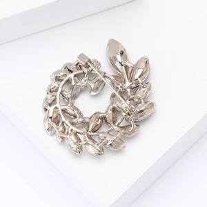 Detailed back view of silver olive branch brooch showing secure metal pin clasp mechanism