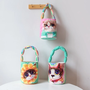 Minimalist bucket bag with cartoon cat print and woven handles for casual style
