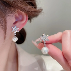 Elegant snowflake zirconia earrings with white pearl pendants in silver finish for women