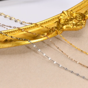 Detailed macro view of flat blade link necklaces in gold, rose gold and silver colors