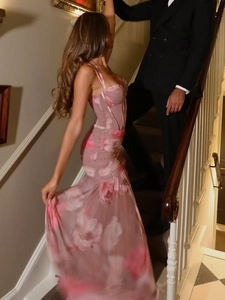 Detail of pink floral print mesh fabric and mermaid hem on elegant evening gown