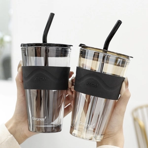 Minimalist Aurora glass straw cup set with silicone sleeves in black and amber colors