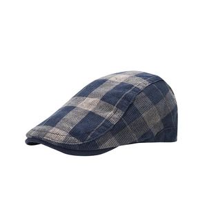 Retro blue and gray plaid corduroy beret hat shown from a 45-degree angle in high detail