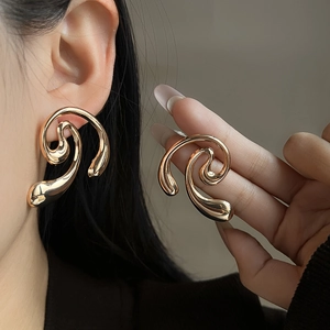Vintage style gold hollow heart flower pearl earrings with an abstract swirl design