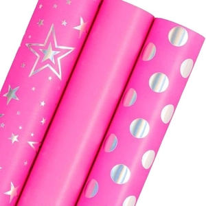 Pink wrapping paper rolls with holographic gold stars and dots for luxury gift packaging