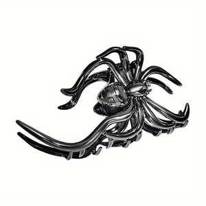 Minimalist black metal spider hair claw clip with sleek metallic finish on white background