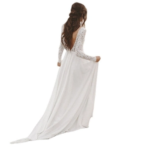 Elegant white lace wedding dress with a deep open back and long sleeves for a bridal look